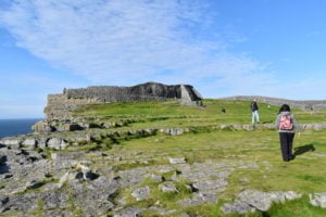 Walking near the edge towards some ancient ruins