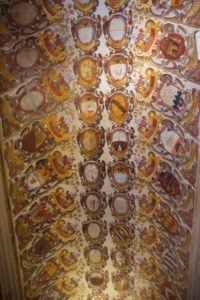 Coats of arms of graduates adorn the ceilings and walls of Bologna University