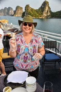 Aboard our luxury Junk in Ha Long Bay, the author makes spring rolls