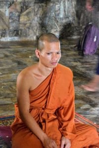 Oudong Cambodia monk inside the Vispassan Dhura temple